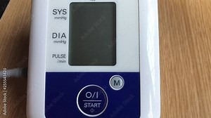 homemade blood pressure measurement using electronic sphygmomanometer with digital display for cardio risk analysis. diagnostic, therapy and medical concept