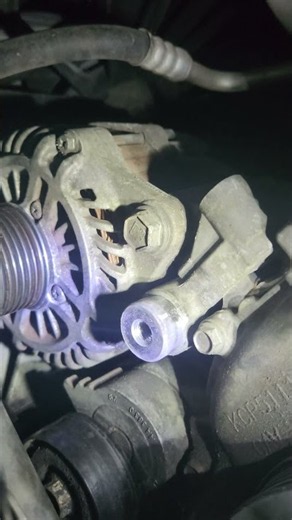 Saving money by changing the alternator on a jeep at home.