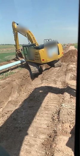 Excavator Falls in Pit After Getting Stuck While Laying Pipes - 1528851