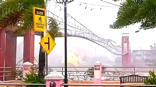 Pedestrian bridge swings wildly as Typhoon Fung-wong slams Philippines
