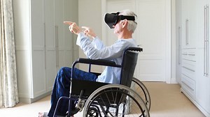 Senior man on wheelchair using vr headset in bedroom Free Stock Video Footage