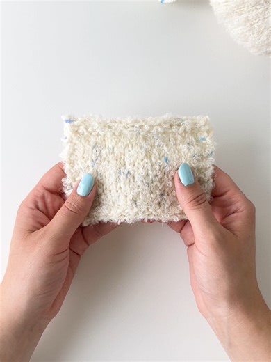 Get this fluffy and super cosy, white and blue combination, by working together DROPS Alpaca Bouclé 0100, off white and DROPS Fiesta 42, ice crystals. Our knitted sample has a knitting tension of about 14 stitches = 10 cm using 6 mm needles, which is a perfect fit for patterns in knitting tension group 15 - 14 stitches. Read more about this yarn combination and find free patterns that you can make with on our site. #dropsalpacaboucle #dropsfiesta #dropsyarncombination #dropsdesign