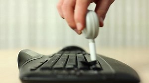 Download Fingers cleaning laptop keyboard for free