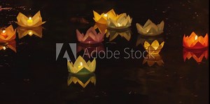 ground of paper light candle floating on river water at night for annual Vesak Buddhist festivals celebration in south East Asia