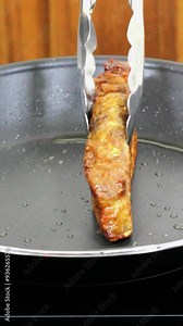 Homemade pork rinds or chicharrones carnudos in Spanish, easy to make in a kitchen pan. They are crunchy, meaty and delicious.