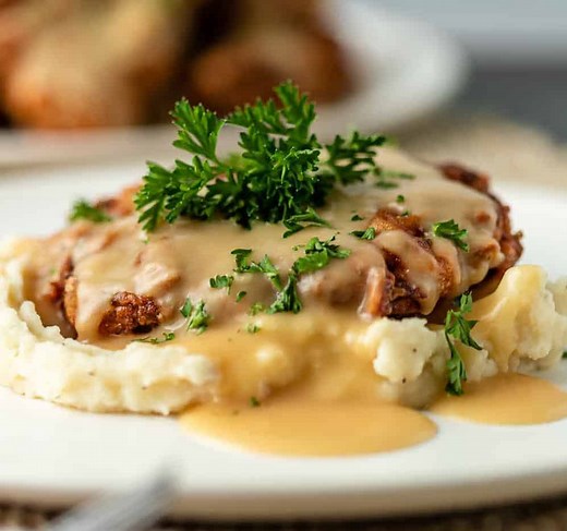 This recipe for chicken fried steak is easy to make and served with homemade gravy. Make this comfort meal for dinner or a hearty breakfast! https://keviniscooking.com/chicken-fried-steak/ | Kevin Is Cooking