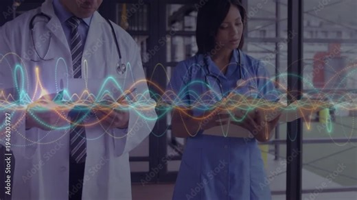 Waveform pulse starting, doctor and nurse scrolling and flipping records while logging data