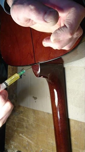 Neck Heel Repair with a Strap Button Installation