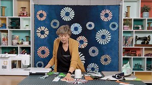 Jenny Doan is "quilting the cosmos" with Dresden-plate stars on a vast ombre background. She's using Orbital Sunrise batiks by astronaut-quilter Karen Nyberg. (This collection is inspired by Earth's landscapes as seen from the International Space Station!) The Milky Way quilt is designed for creativity. Make it your own with two-color Dresdens in any size; this is astronomical applique at its best! Watch the Milky Way tutorial now: https://bit.ly/milkyway_fb | Quilting Deals - Missouri Star Quil