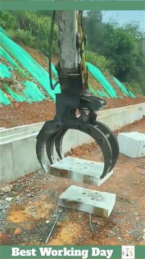 Laying concrete blocks with an excavator - construction of a drainage ditch