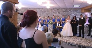 Bride catches everyone off guard when she has groom's ex stand up during vows