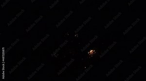 Fireworks exploding in urban city with street lights and transport England UK 4K