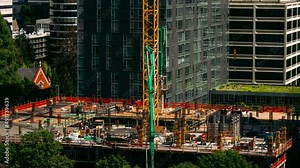 A construction crew builds a new apartment building in downtown Portland, Oregon.