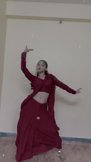 Elegant Traditional Dance Performance in Red Outfit