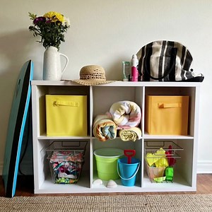 Creating an organized entryway doesn’t have to cost a lot of money or take up a lot of space. A cube organizer and a few bins can make a big difference! https://brnw.ch/21wKZTD #HomeInspo #ClosetMaid #EntrywayOrganization #EntrywayDesign #Mudroom #CubeOrganizer #OrganizationTips #HomeOrganization | ClosetMaid