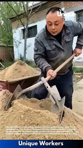Man Uses Double Shovel to Load Sand into Wheelbarrow