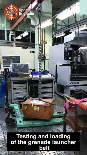 Durability testing and loading of grenade launcher ammunition feed belts.