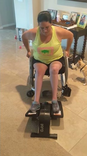 Paraplegic using Cubii elliptical machine for exercise