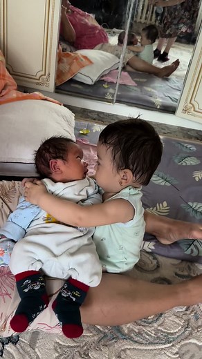 Sibling Love: A Heartwarming Moment Between Children