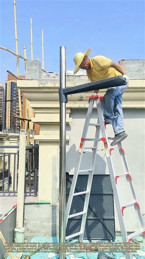 Bolting the Spiral: How a Worker Assembles a Stainless Steel Staircase