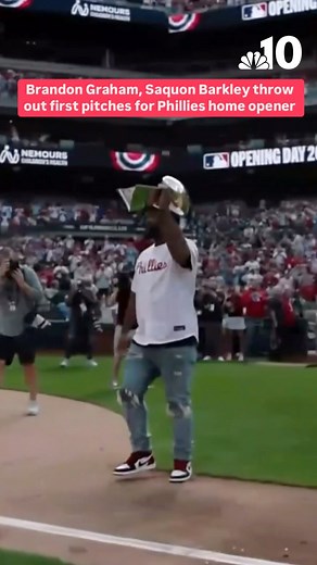 Philadelphia Eagles legend Brandon Graham, with the Lombardi trophy in hand, as well as Eagles superstar Saquon Barkley threw the first pitches ahead of the Phillies home opener on Monday. | NBC10 Philadelphia