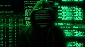 Hacker in Hoodie with Animated Green Digital Code