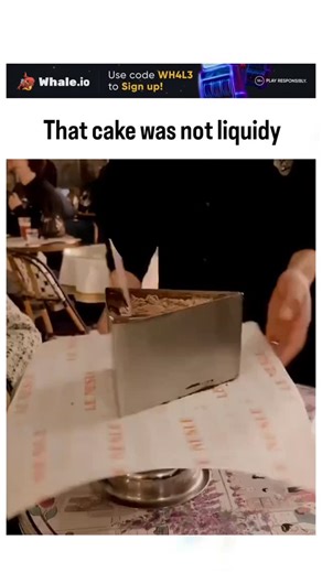 curvico_explained on Instagram: "The video depicts a "Matilda Cake," a chocolate dessert inspired by the infamous scene in Roald Dahl's Matilda where a boy devours a massive cake as punishment, here presented in a silver box at a restaurant with molten ganache dramatically spilling out upon opening. The caption "That cake was not liquidy" delivers ironic humor, directly contradicting the runny chocolate flow shown, which has fueled viral debate in replies—critics call it overly messy or a "fail,