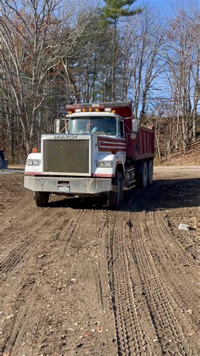 It’s a beautiful day to move some dirt! Our retaining wall is almost finished. Next step – the foundation! | Kate's Ace Hardware