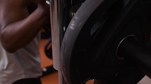 Person lifting weights in gym | Free Stock Video Footage