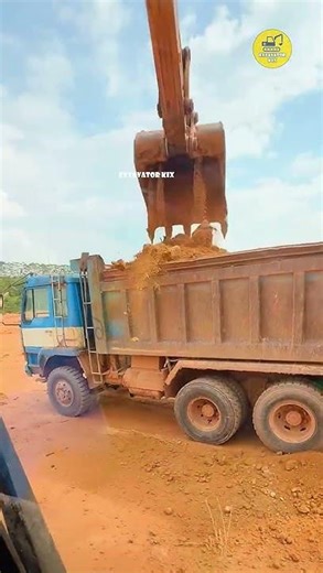 Excavators Load Soil Onto Trucks