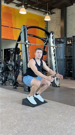 Build Stronger Legs With This Bodyweight Movement: 1.5 Rep Slant Board Squat