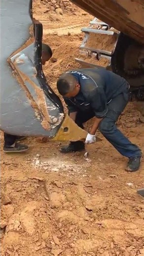 Replacing the rear plow hook on a Caterpillar D11 bulldozer