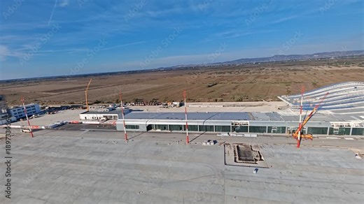 Aerial view of the new international airport under construction in Vlore Albania, a project known for repeated delays, showing unfinished runways, buildings, and large scale infrastructure development