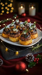 These elegant Christmas filet mignon bites are the perfect holiday appetizer! 🎄✨ Tender beef medallions topped with caramelized mushrooms and onions, fresh herbs, and creamy garlic butter—all served on crispy golden puff pastry rounds. These bite-sized beauties look fancy but are surprisingly easy to make! Perfect for Christmas Eve, holiday parties, or New Year's celebrations. Your guests will be amazed #Christmas #steak #Recipe #food #romance | Chickeats Recipes