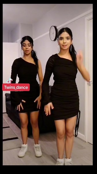 Twins Dance Synchronized Routine in Stylish Living Room