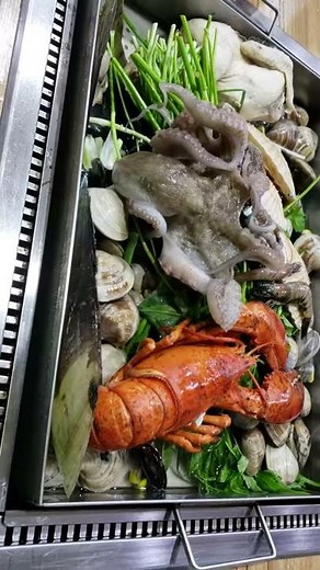 Octopus cooked aLive, live fresh seafood and clams other shellfish for dinner in korea!