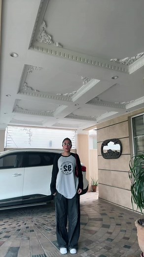 Person in Driveway: Fashion and Movement Exploration