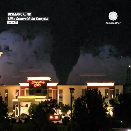 Confirmed Tornado Over North Dakota: Lightning Illuminates the Scene! 🌪️⚡ A tornado was spotted in Bismarck, ND, with warnings of flying debris and hail. | AccuWeather