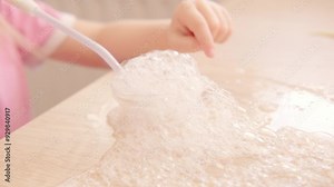 child engages in mesmerizing science experiment with soap bubbles, exploring world of soap foam and science, passion for discovery, Activities involving trials related substances and forces in nature