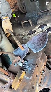 Metal pressed firm on dusty bench—gloved hands shape coil in focused morning forgework