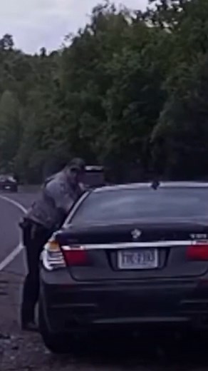 Heart-stopping police dash-camera footage shows an out-of-control car spin across a median and hit a stopped car and an officer making a traffic stop in Fairfax County, Virginia. The crash could have ended in tragedy — but the officer saw the car coming and ran. | NBC Washington