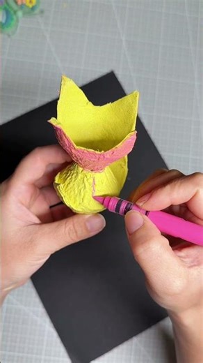 Colorful fish made by cutting and painting egg cartons.