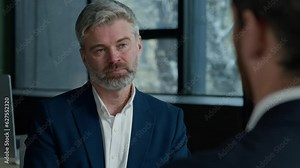 Caucasian man businessman HR manager seller consultant sales agent advise customer in office hiring new employee conduct interview consulting client talk to business partner explaining details deal vídeo do Stock