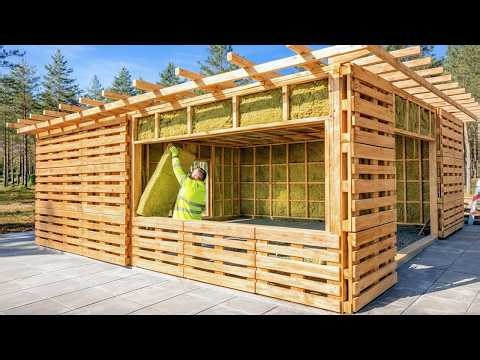 This man is building a million-dollar garage out of wooden pallets he collected from the trash!