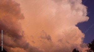 Big dark fire clouds of smoke rise above the city, forests burn. Dark red, black and grey smoke in the sky. 4k footage.