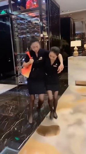 Drunk girl loses her high heels, she walks with black nylon feet