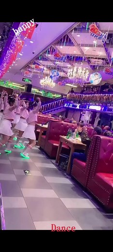 Happy Dance Routine in Festive Indoor Setting