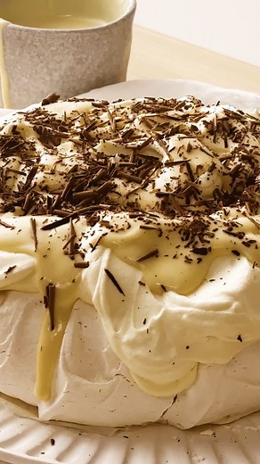 Move over whipped cream - we’re topping classic pavlova with homemade Baileys custard for a truly decadent Aussie dessert. Plus, it’s a great way to use up the leftover egg yolks from the pav! Click the link in our Instagram bio for the full recipe or Google “Taste pavlova with whipped Baileys custard”. Recipe by @_aliceadamsfood #pavlova #meringue #baileys #custard #dessert | Taste.com.au