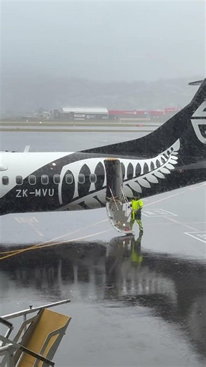 Air NewZealand ATR 72-600 ZK-MVU prepares for departure very wet Wellington