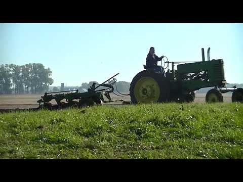 John Deere A plowing